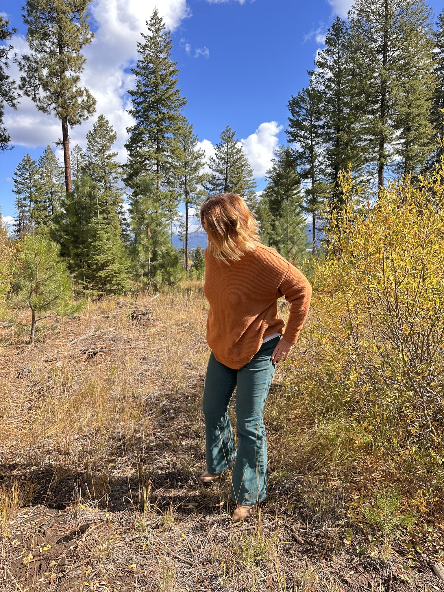 McCall Idaho Realtor Ragan Erickson exploring mountain property—showing why buying an existing vacation home is the fastest way to generate cash flow from short-term rentals.
