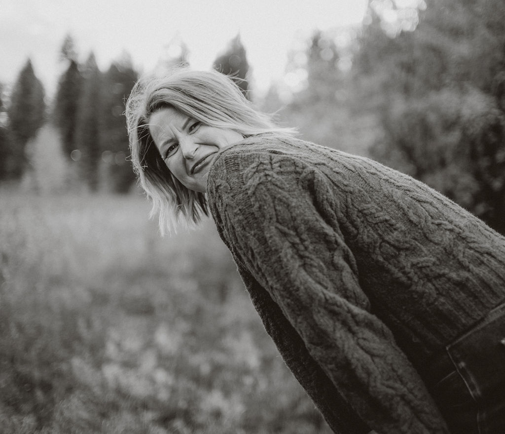 Ragan Erickson, McCall, Idaho Realtor and Short Term Rental coach smiling for the camera at Ponderosa Park in McCall, Idaho