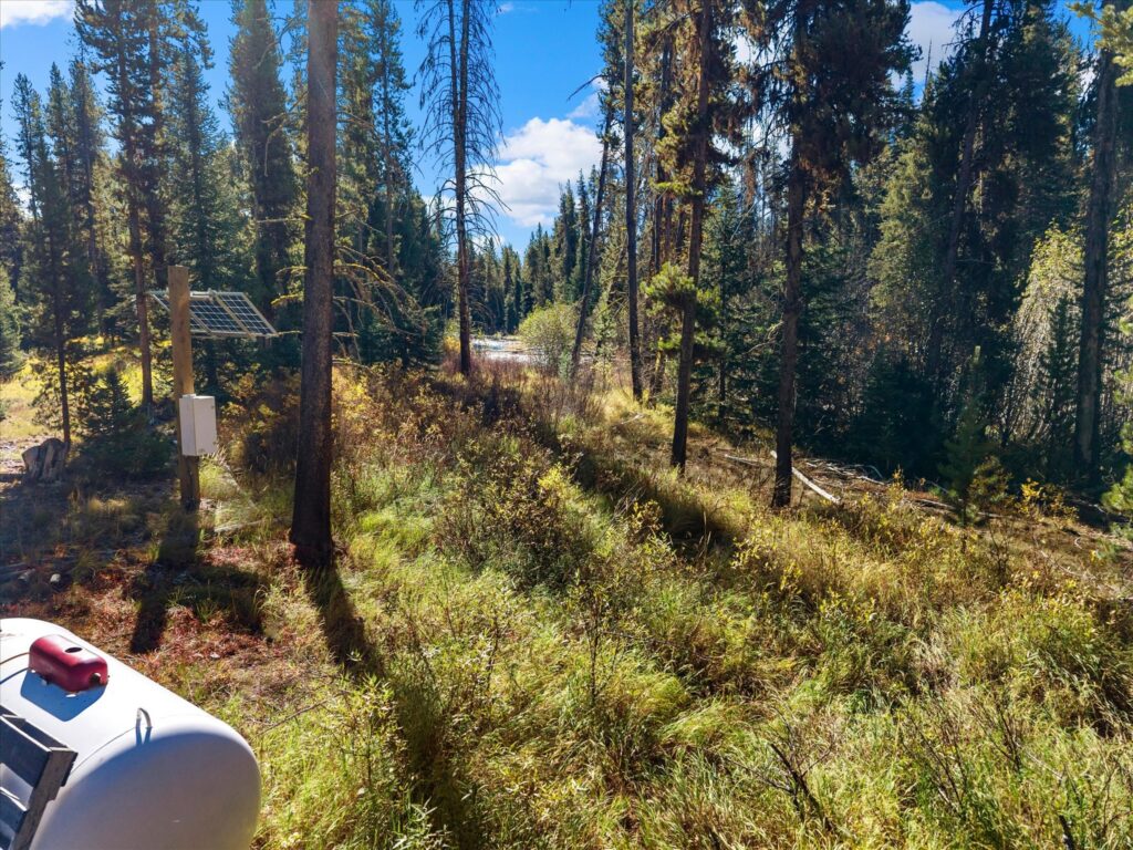 Off-grid systems at the cabin: solar panel and propane tank