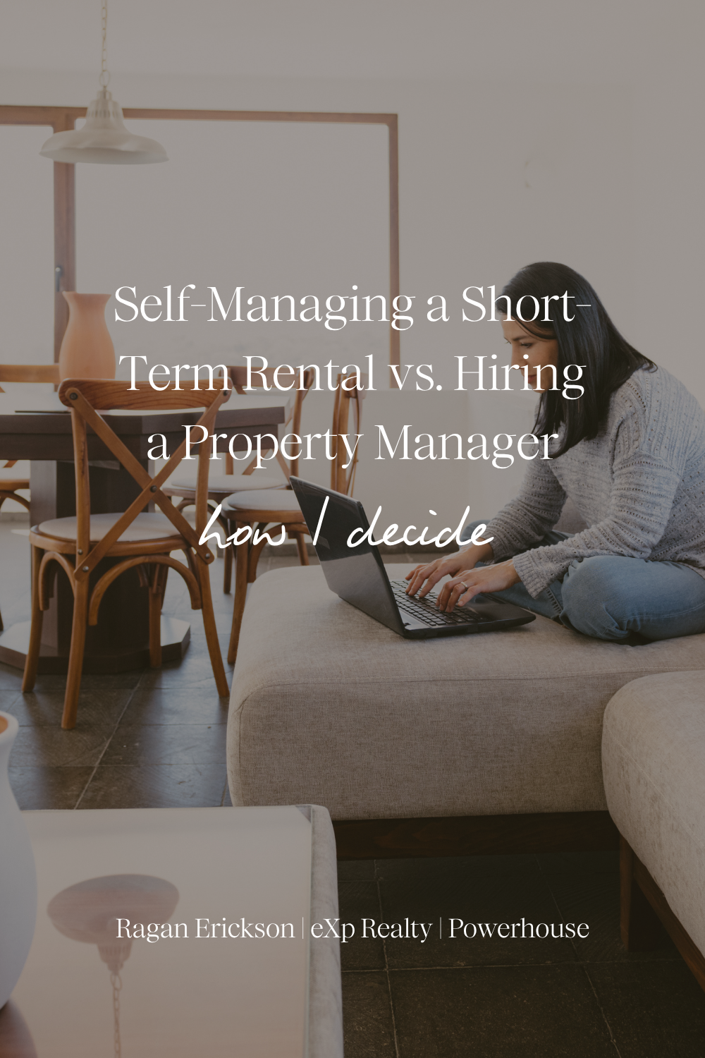 Woman with dark hair in a gray sweater sits cross-legged on a beige sofa typing on a laptop in a bright, minimal living room with a wooden dining table. Text overlay reads “Self-Managing a Short-Term Rental vs. Hiring a Property Manager: How I Decide” with “Ragan Erickson | eXp Realty | Powerhouse” at the bottom.